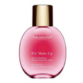 Flacon rose Clarins Fix’ Make-Up 50 ml avec bouchon doré sur fond blanc.