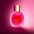 Brume fixatrice Clarins Fix’ Make-Up 50 ml sur un fond rose lumineux.