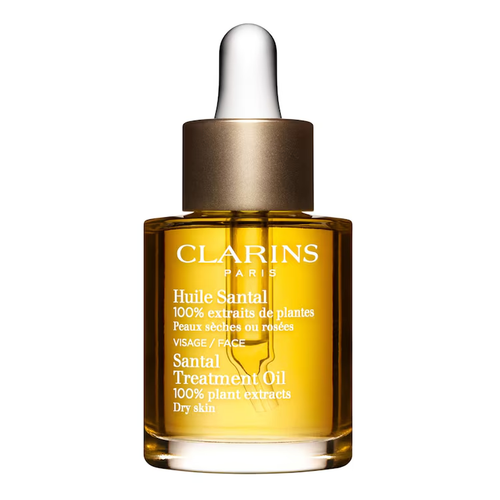 Flacon pipette Clarins Huile Santal 30 ml sur fond blanc.