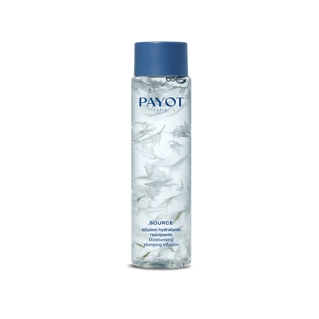 Flacon PAYOT Source Infusion Hydratante Repulpante 125 ml avec pétales en suspension, sur fond blanc.